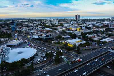 High angle view of city street and buildings against sky