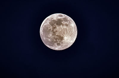 Low angle view of moon against sky at night