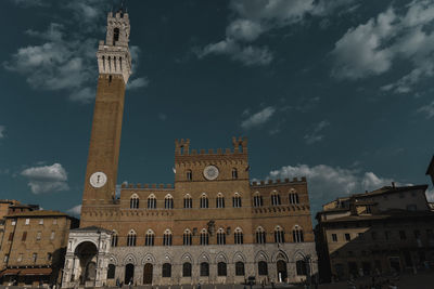 Low angle view of historical building against blue sky