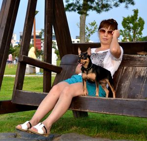 Young woman sitting in park