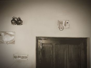 Close-up of clock on wall at home