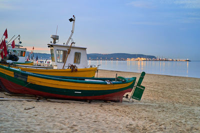 Boats in sea against sky