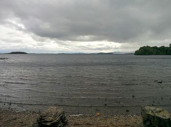 Scenic view of sea against cloudy sky