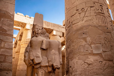 Different columns with hieroglyphs in karnak temple. karnak temple is the largest complex in egypt.