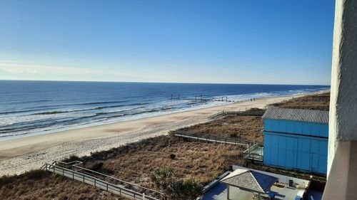 Scenic view of sea against clear blue sky