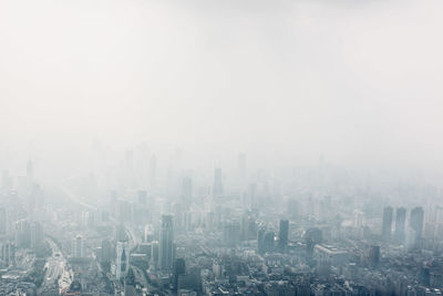 Aerial view of cityscape against sky