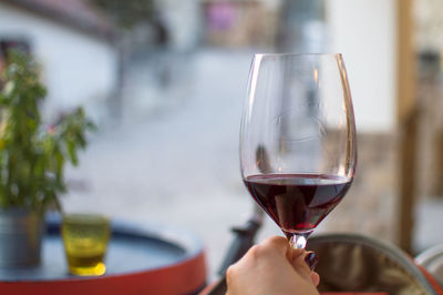 Close-up of hand holding wineglass