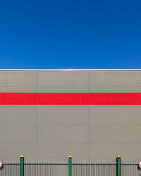 Low angle view of building against clear blue sky