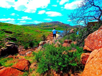 Scenic view of landscape against cloudy sky