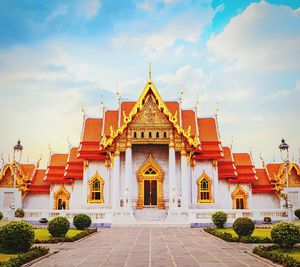 Facade of temple building against sky