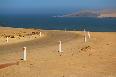 The desert road along the ocean, paracas national reserve in ica region of peru