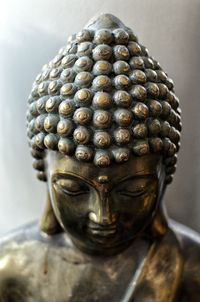 Close-up of buddha statue in temple