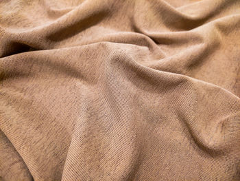 Brown cloth texture background with soft waves