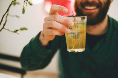 Close-up of man holding drink