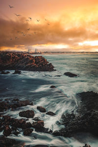 Scenic view of sea against sky during sunset