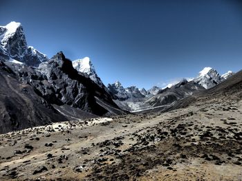 Scenic view of snowcapped mountains against clear sky