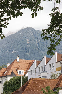 Houses and mountains against sky