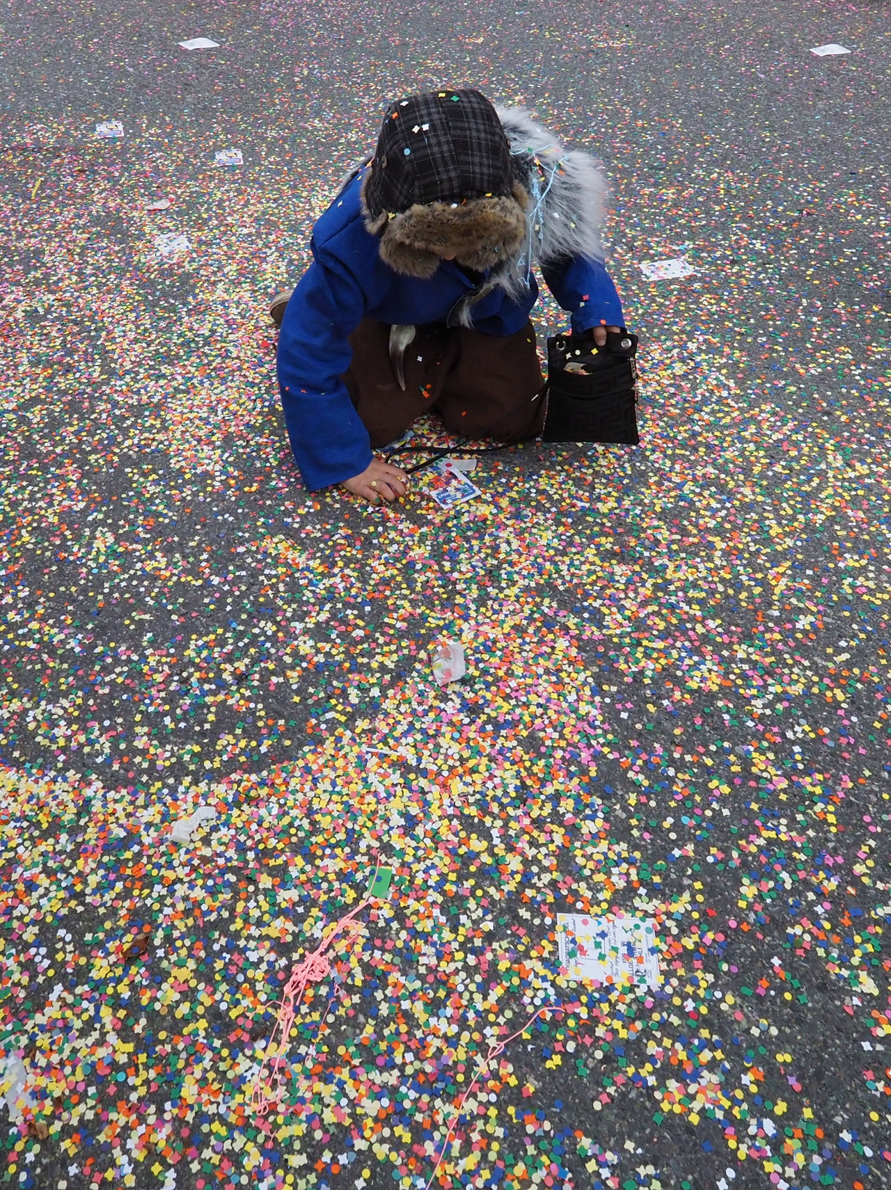 Boy collecting confetti