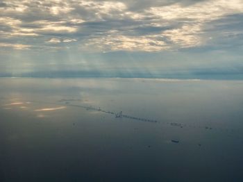 Scenic view of sea against cloudy sky