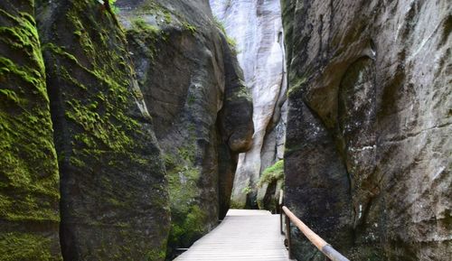 Narrow footpath leading towards rock formation