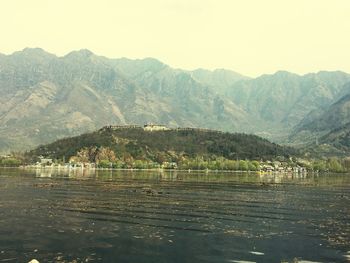 Scenic view of lake and mountains against sky