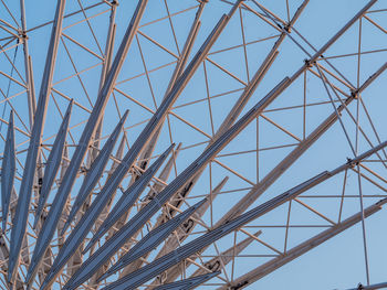 Low angle view of metallic structure against sky