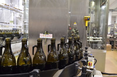 Panoramic shot of olive oil bottles on production line