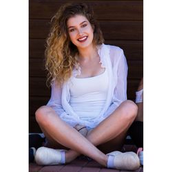 Young woman sitting on deck