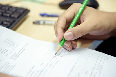 Close-up of woman working on table