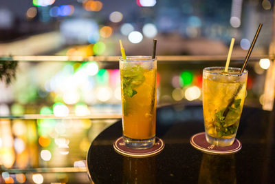 Close-up of beer glasses on table