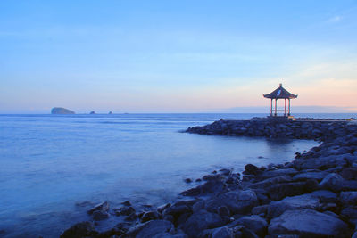 Scenic view of sea against sky during sunset
