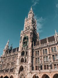 Low angle view of historical building against blue sky