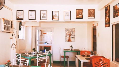 Empty chairs and table against wall at home