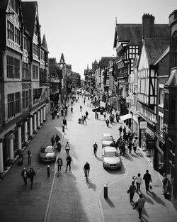 High angle view of people walking on street in city