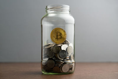 Close-up of candle in jar on table