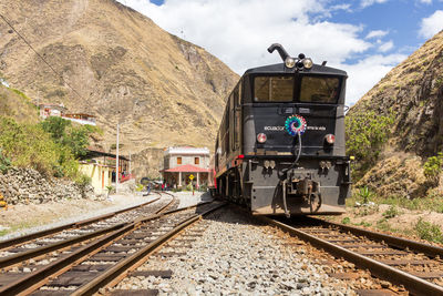 Train on railroad track against sky