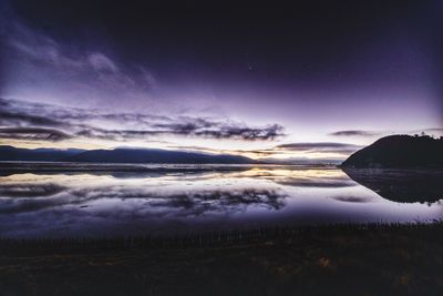 Scenic view of lake against sky during sunrise