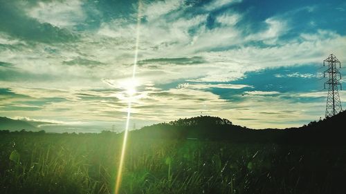 Scenic view of field against sky during sunset