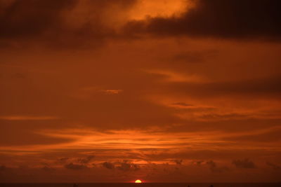 Low angle view of dramatic sky during sunset