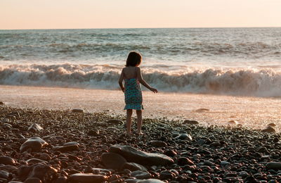 Little girl playing at the beach