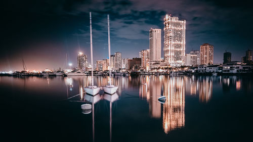 Reflection of cityscape in manila bay