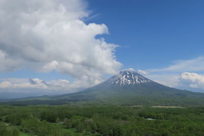 View of volcanic mountain against cloudy sky