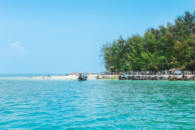 Scenic view of sea against blue sky