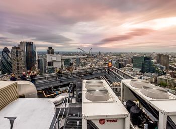 Cityscape against cloudy sky