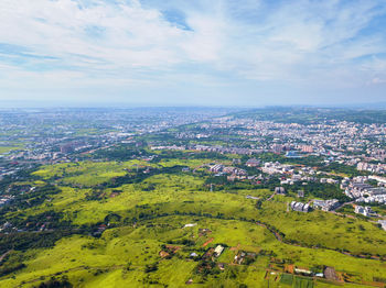 Aerial view of townscape against sky