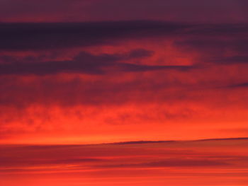 Scenic view of dramatic sky during sunset