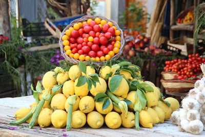 Various vegetables and fruits for sale at market stall