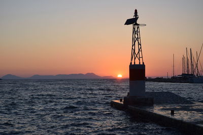 Scenic view of sea against romantic sky at sunset