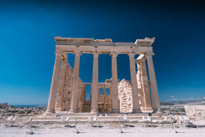 Low angle view of temple against blue sky