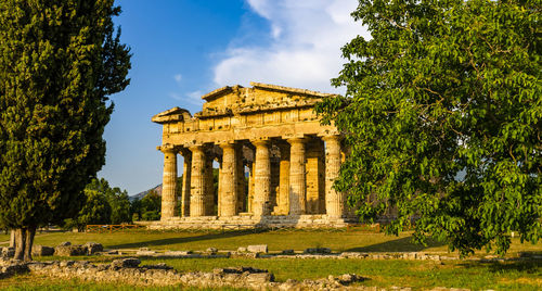 Front view of historical building against clear blue sky  , temple of paestum. italy